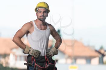 Portrait Of Handsome Male Architect Engineer With Yellow Helmet