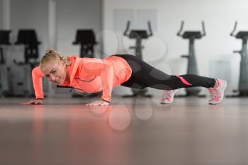 Woman Athlete Doing Pushups As Part Of Bodybuilding Training