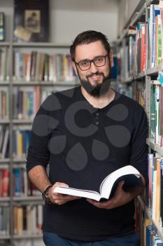 Portrait Of An Caucasian College Student Man In Library - Shallow Depth Of Field