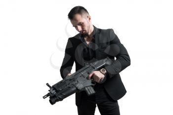 Man Isolated on a White Background With a Handgun as He Turns and Aims Off Camera