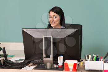 Portrait Of A Young Business Woman Using A Computer In The Office