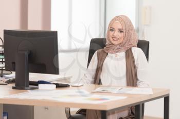 Happy Young Muslim Business Woman Work In Modern Office On Computer