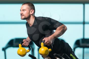 Young Man Working With Kettle Bell In A Gym - Kettle-bell Exercise