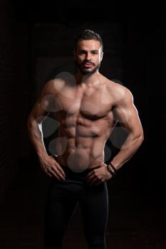 Portrait of a Young Physically Fit Model Showing His Well Trained Body - Muscular Athletic Bodybuilder Fitness Man Posing After Exercises