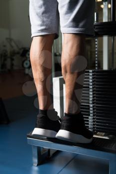 Bodybuilders Legs Shot Close Up In A Gym In Workout