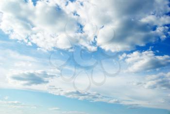 Royalty Free Clipart Image of White Clouds in a Blue Sky