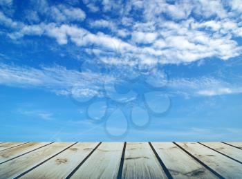 Royalty Free Photo of a Wooden Deck and the Sky