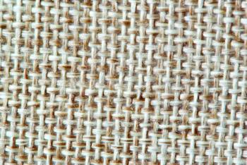 Textured background of a sandy brown burlap cloth