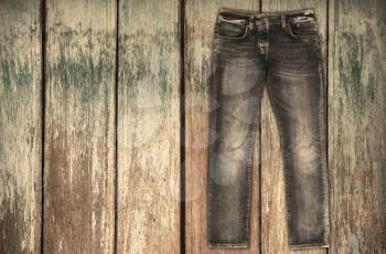 Blue jeans trouser over white wood planks background
