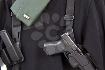 Military uniform, cap, pistol, ammo clip, and holster