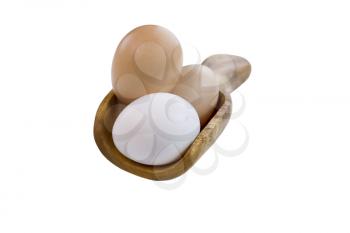 Horizontal photo of fresh organic whole eggs in wooden spoon on pure white background