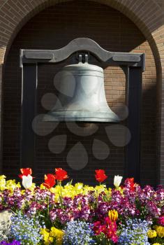 Memorial Bell in Capital of Victoria Canada with Brick Wall in Background