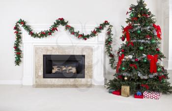 Natural Gas Fireplace with fully decorated Christmas tree in living room of home during holidays
