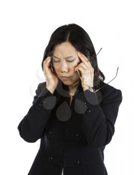 Mature Asian woman with a stressful moment holding glasses on white background
