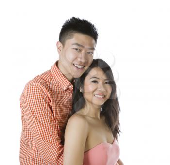 Photo of young adult couple with man holding his woman on a white background 