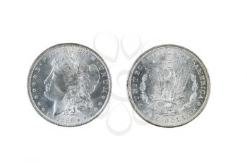 Closeup photo of a Two Morgan Silver Dollars, obverse and reverse sides, isolated on white  
