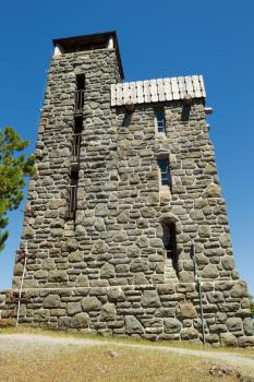 Vertical photo of Mount Constitution Summit building at Morgan State Park in Washington State on Orcas Island during a beautiful summer day