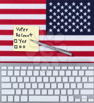 Keyboard with USA Flag and decision paper to do a recount on the election. 
