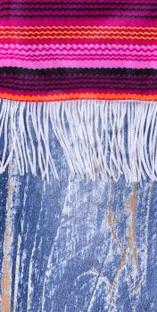 Close up of colorful serape with fringe for Cinco de Mayo holiday concept. Vertical layout. 