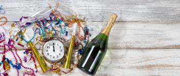 Celebration at Midnight for New Year with party objects and Champagne 