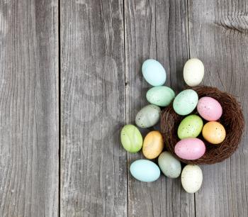 Colorful eggs on Vintage Wooden Planks for Easter Background 