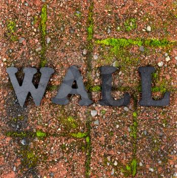 Red grunge brick stone with metal letters for wall concept