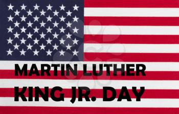 Happy Martin Luther King JR Day background with letters and USA flag