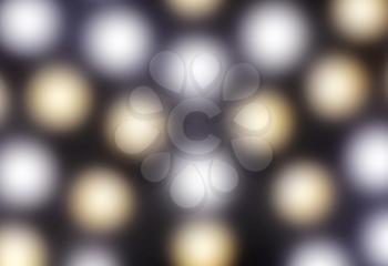 Glowing gold and silver round lights in defocused blur motion abstract background texture   