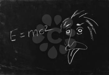 Ooops. The genius Albert Einstein show tongue. Sketch on blackboard.