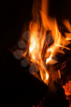 Closeup fireplace with burning fire woods.