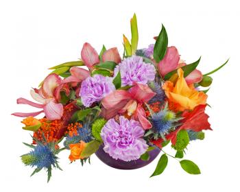 Floral bouquet of orchids, gladioluses and carnations arrangement centerpiece in blue glass vase isolated on white background