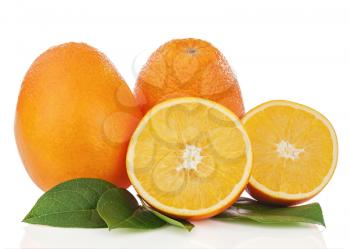 Fresh orange fruits with green leaves isolated on white background. Closeup.