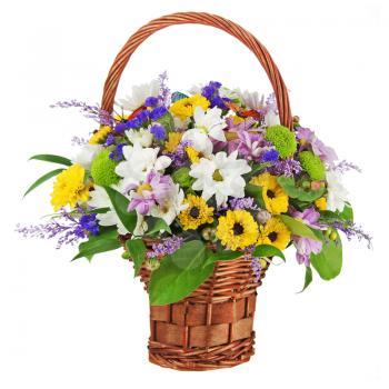 Bouquet from gerbera flowers in wicker gift basket isolated on white background. 