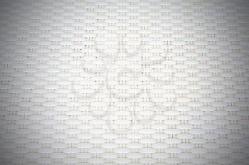 White cream plastic surface with repeating pattern. For use as background.