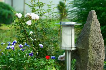 Solar Powered Lamp on Garden Background. Selective Focus.