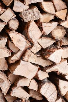 Woodpile from dry oak logs. Selective focus.
