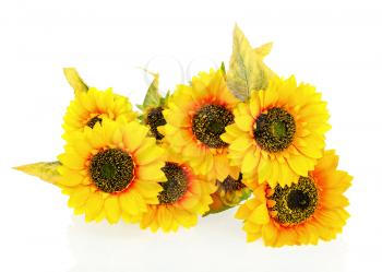 Composition of bright artificial sunflowers on white background. Closeup.
