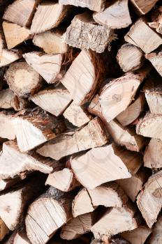 Woodpile from dry oak logs. Selective focus.