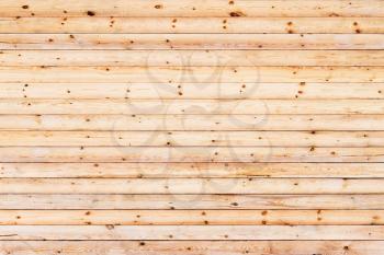 Wood pine planks lite brown texture fragment as a background composition.