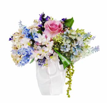 Colorful flower bouquet arrangement centerpiece in vase isolated on white background.