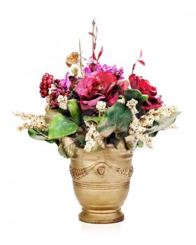 Colorful flower bouquet from artificial flowers arrangement centerpiece in gold vase isolated on white background.