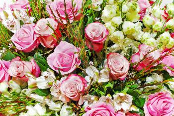 Colorful floral bouquet of roses, lilies and orchids arrangement centerpiece.
