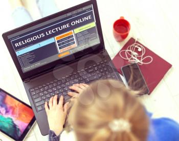 Religious Lecture Online. Blurred Female Holding Ultrabook with Open Educational Website. Post-secondary Learning Concept. Top View.