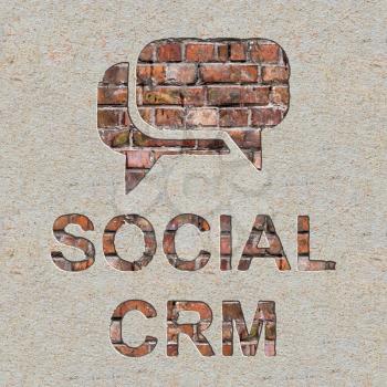 Social CRM Concept  with Speech Bubble Icon on the Brick and Plastered Wall.