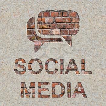 Social Media Concept with Speech Bubble Icon on the Brick and Plastered Wall.