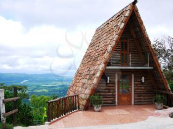 Royalty Free Photo of an A-Frame Cabin on a Mountain