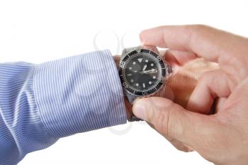 Executive hand holding a wrist watch isolated on white