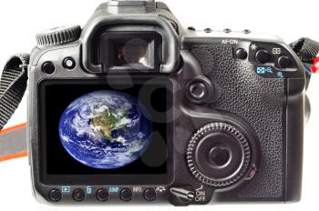 Back of a digital slr camera with the world photo in its display