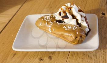 caramel choux pastry on plate with creme