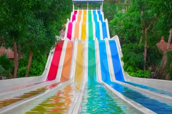Colorful water slides in tropical aqua park